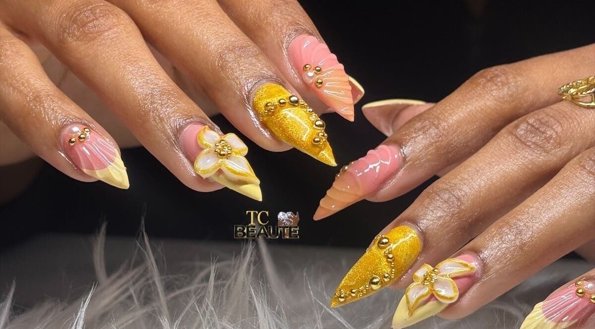 Elegant nail art with gold and pink designs at TC Beauté, San Juan, San Juan-laventille Regional Corporation, TT.