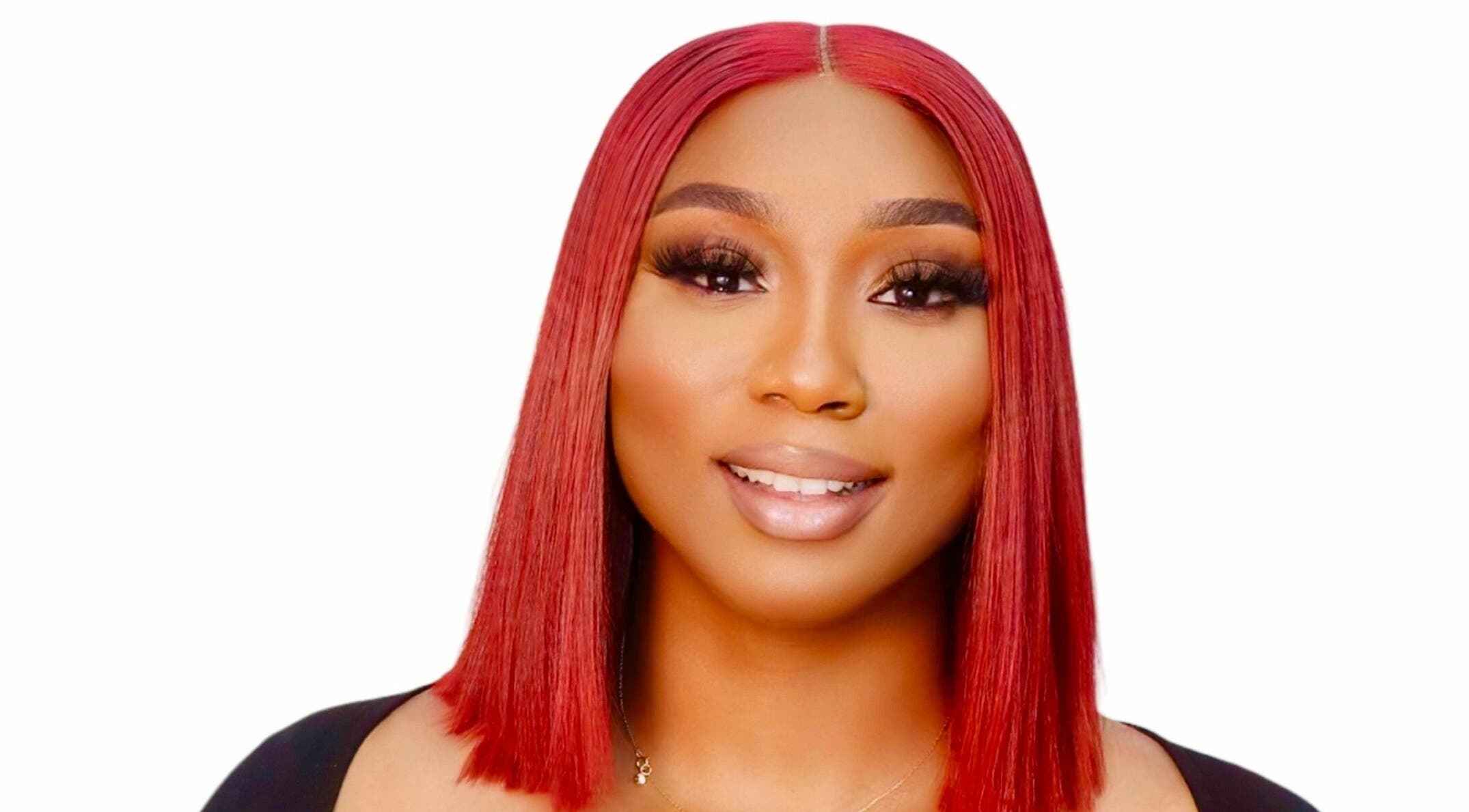 Elegant hairstyle at IsabiBeauty Ltd in Bletchley, England, GB showcasing vibrant red straight hair.