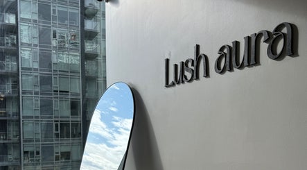 Lushaura Lash Studio exterior with logo and mirror reflecting the sky, Burnaby, British Columbia, CA.