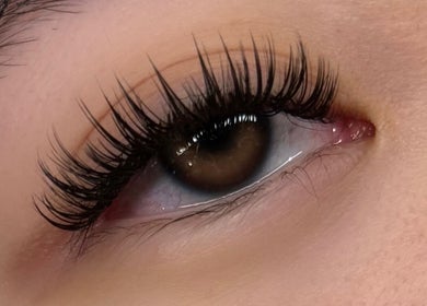 Close-up of a beautifully enhanced eye with long lashes at Lushaura Lash Studio in Burnaby, British Columbia, CA.