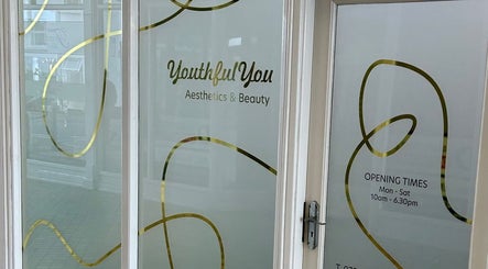 Front entrance of Youthful You, a beauty venue in Barnstaple, England. Elegant design with gold accents.