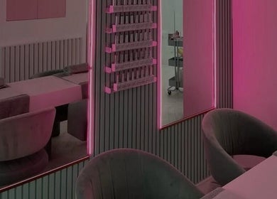 Elegant neon-lit beauty studio at KS Beauty By Kai, Sale, England, GB, showcasing chic decor and modern seating.