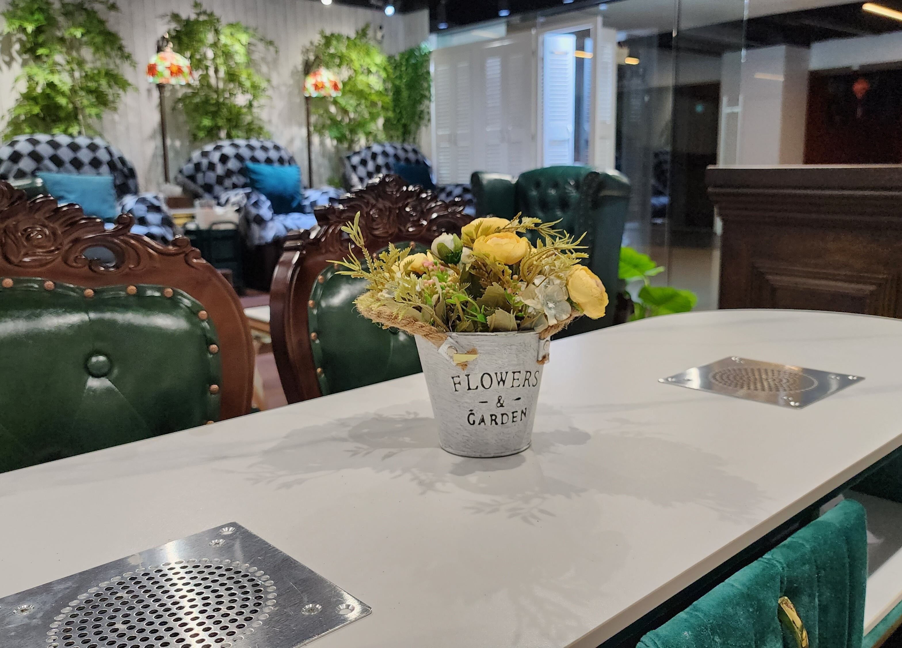 Elegant interior of Home Nails with plush chairs and flowers, Singapore, Singapore, SG.