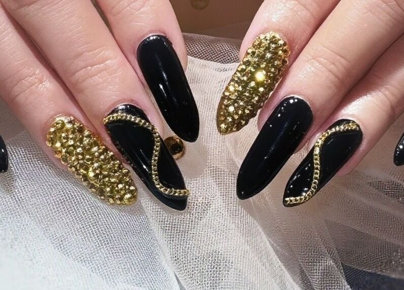 Elegant black and gold nail design at Home Nails, Singapore, SG, showcasing luxury nail art.