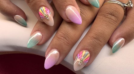 Colorful nail art design at Diamond Nails by Mariela, Sindlesham, England, GB, featuring gradient and patterns.