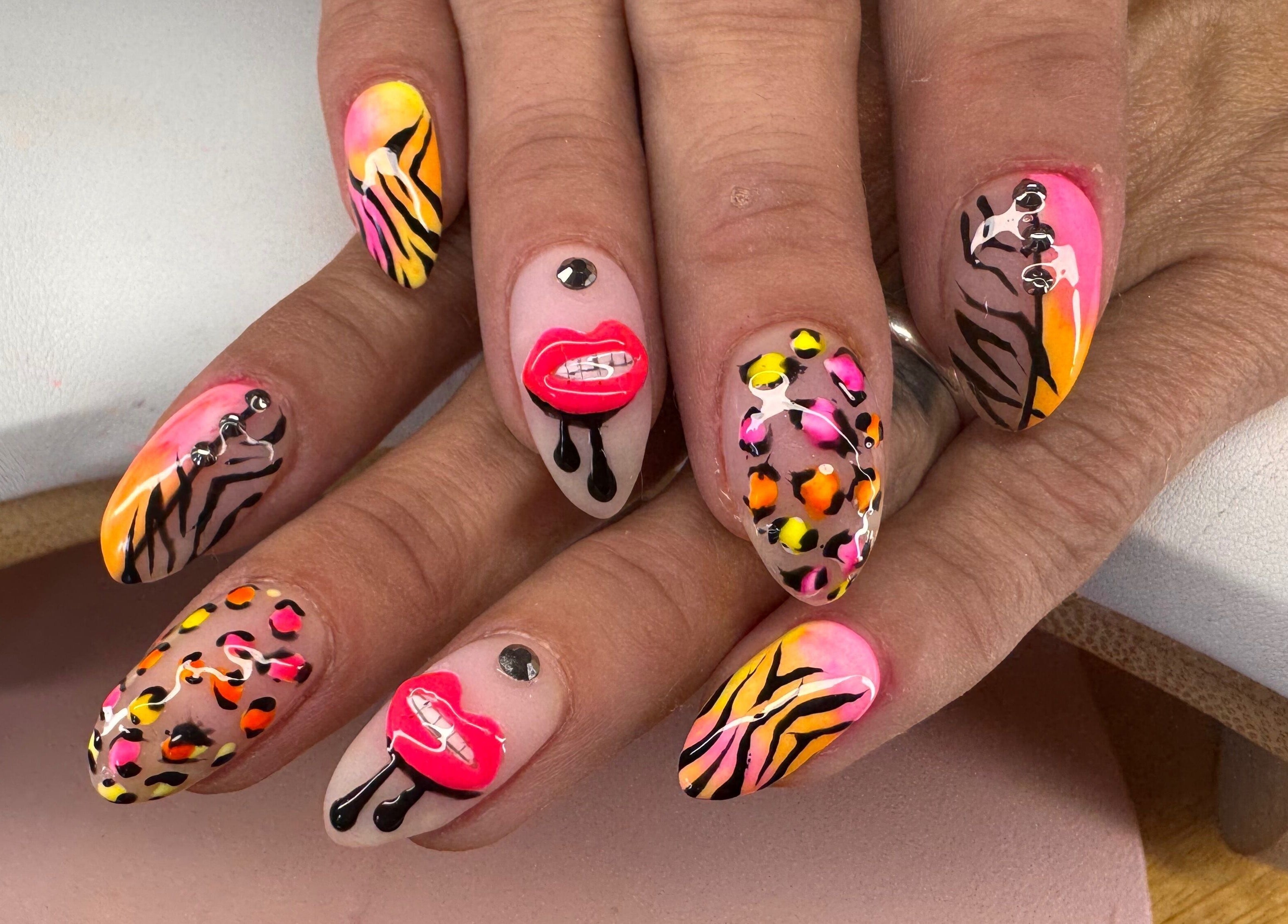 Bold nail art at Diamond Nails by Mariela, Sindlesham, England. Mobile service available for creative designs.