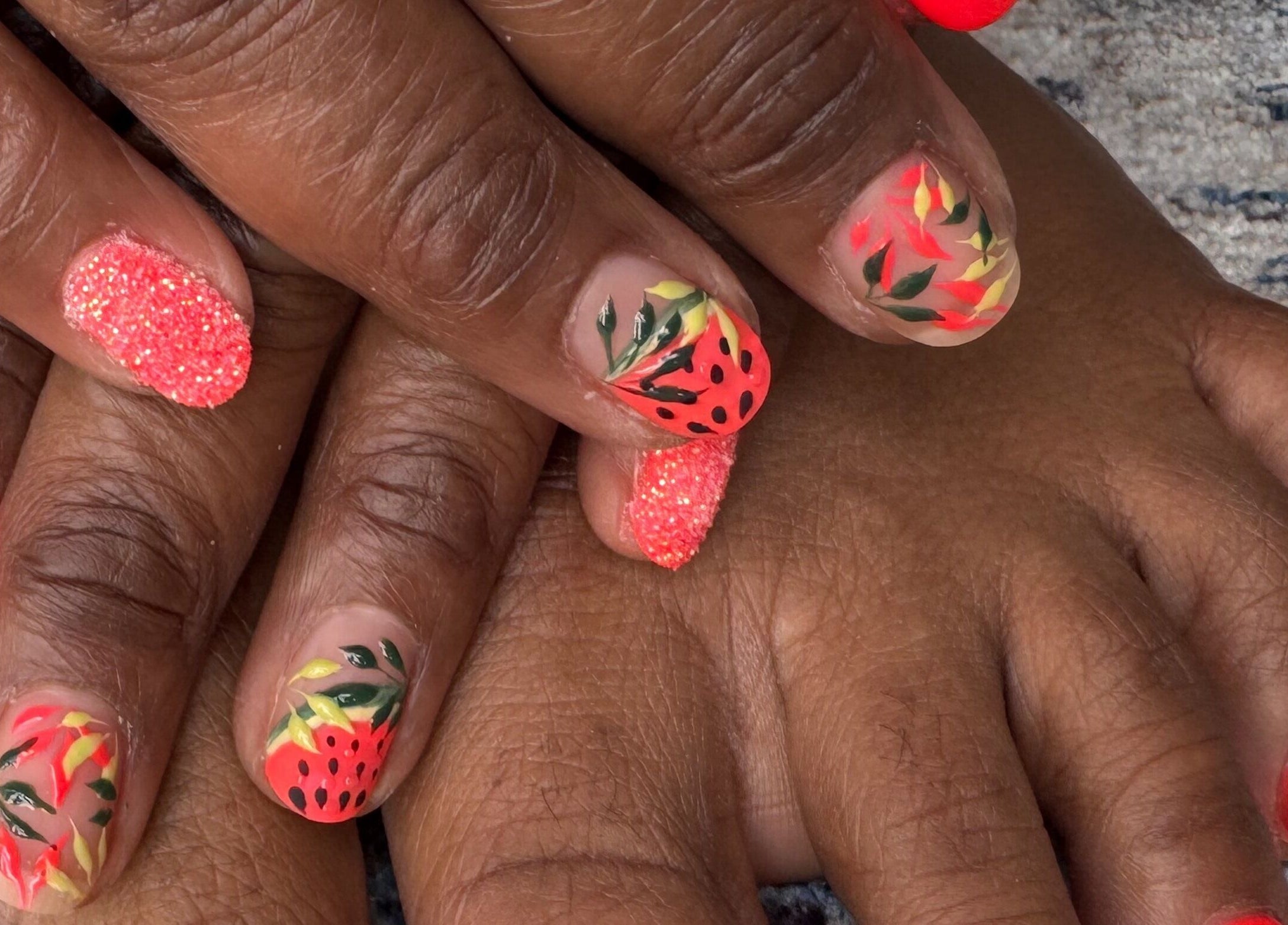 Vibrant floral nail art by Diamond Nails by Mariela in Sindlesham, England, GB, featuring vivid orange and leaf designs.