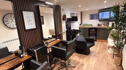 Elegant interior of Hair By Jess salon at Penlle'r-gaer, Cymru, GB with sleek chairs and modern decor.