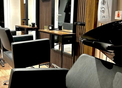 Modern salon chairs and wash station at Hair By Jess in Penlle'r-gaer, Cymru, GB.