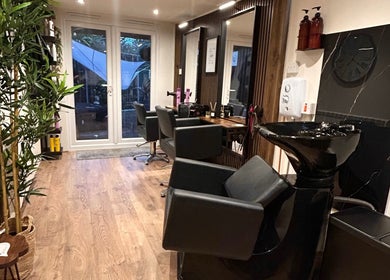 Elegant salon interior at Hair By Jess, Penlle'r-gaer, Cymru, GB with styling chairs and wash station.