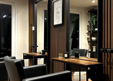 Modern salon interior at Hair By Jess in Penlle'r-gaer, Cymru, GB with sleek chairs and mirrors.