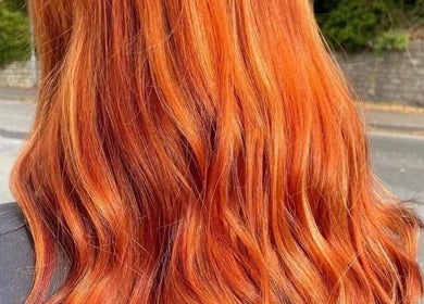Fiery red hair styled in waves at Hair By Jess, Penlle'r-gaer, Cymru, GB.