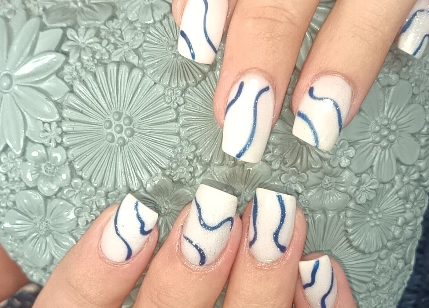 Stylish white nails with blue waves at Beauty and Hair with Flair, Pongola, Kwazulu-natal, ZA.
