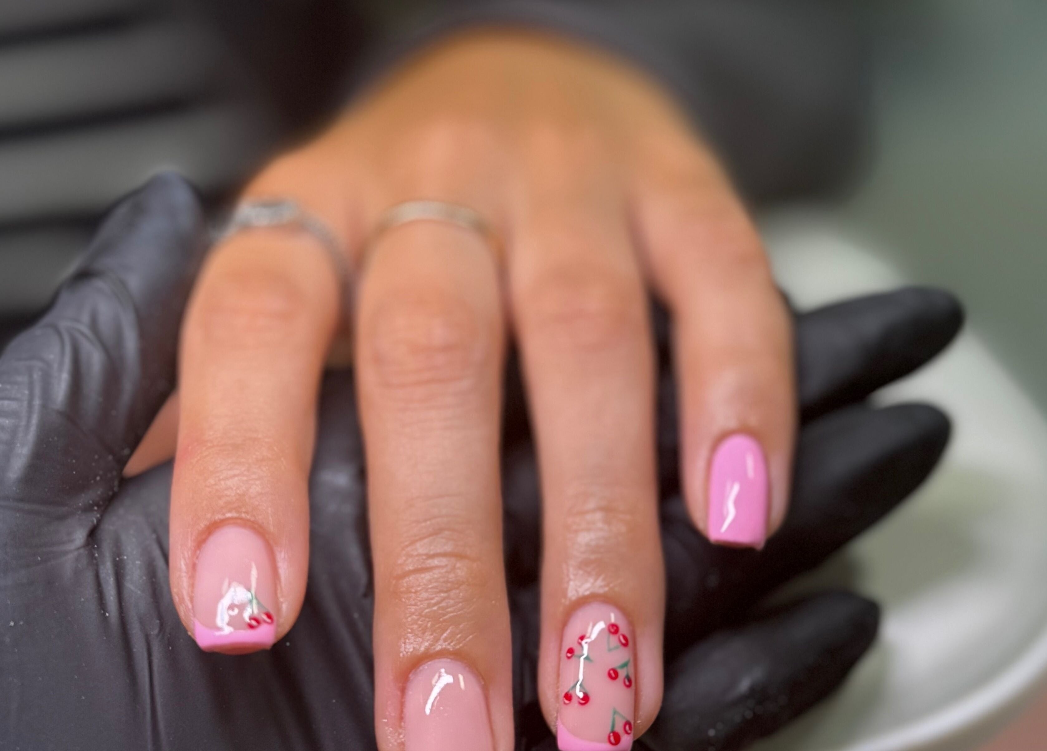 Elegant pink nails with cherry design at ByAbi, Dinnington, England, GB.