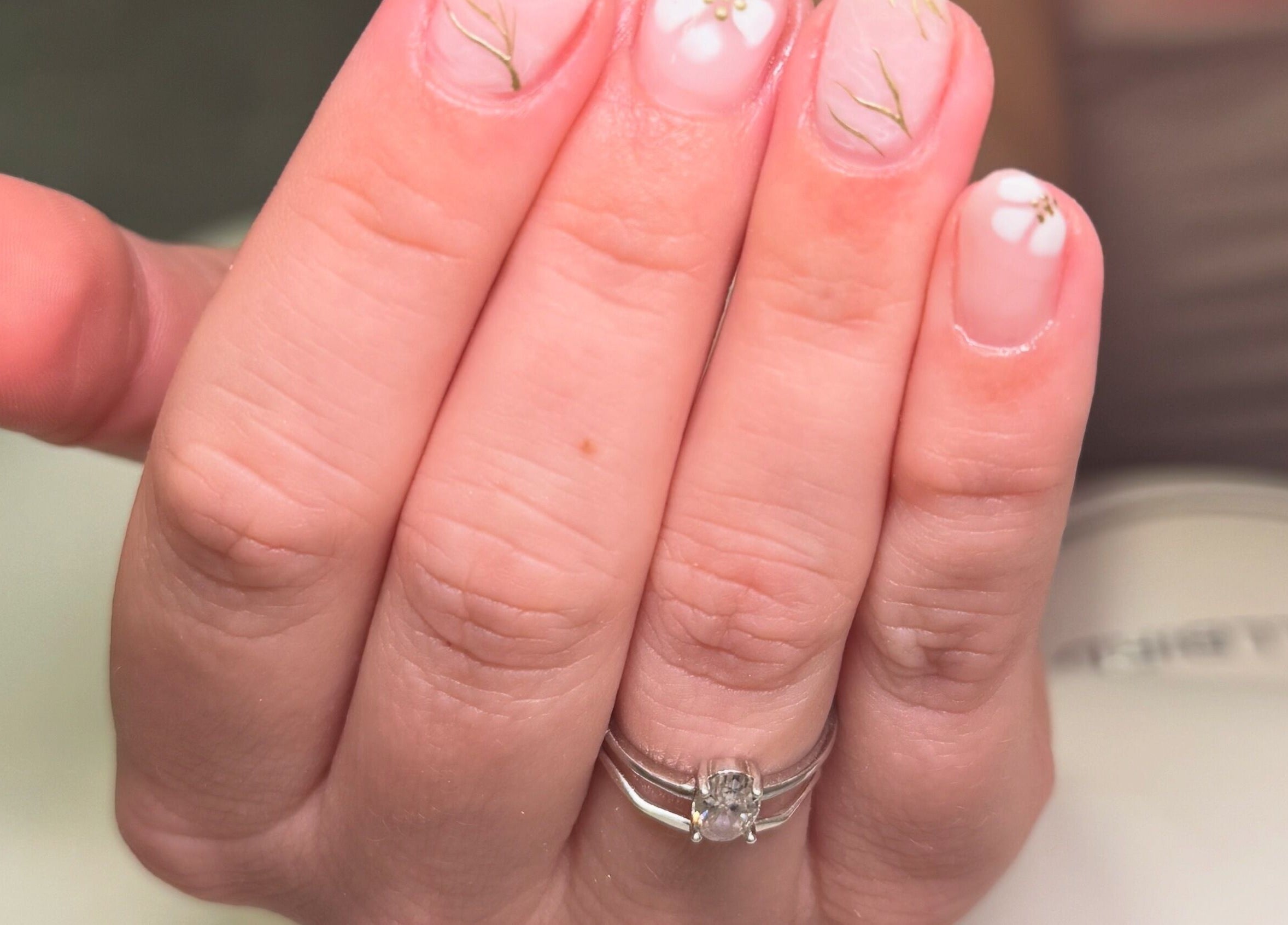 Elegant floral nails design by ByAbi in Dinnington, England, GB, showcasing delicate artistry.