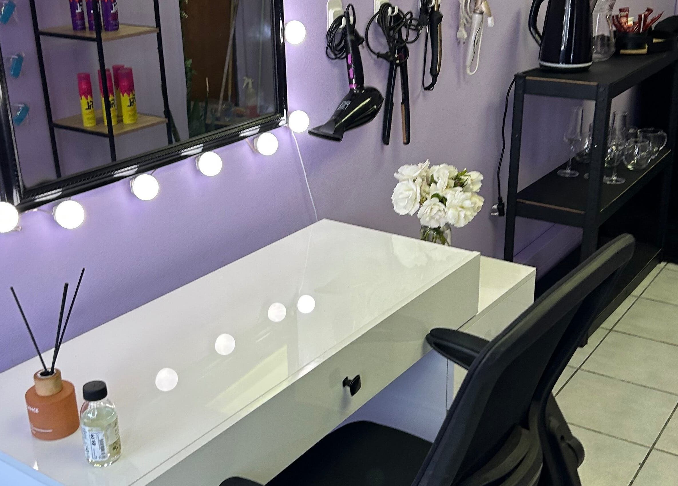Vanity setup at Face Card Aesthetics, Pretoria, Gauteng, ZA with illuminated mirror and hair tools.
