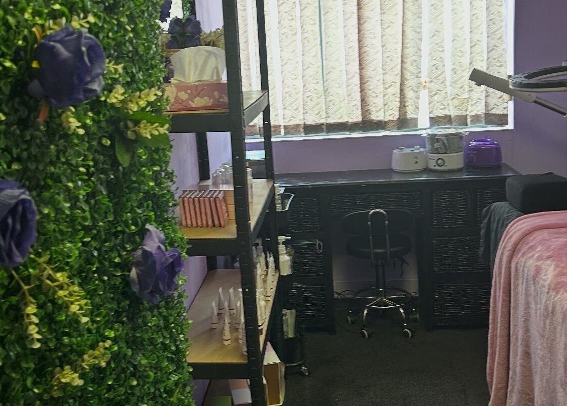 Relaxing treatment room at Face Card Aesthetics, Pretoria, Gauteng, ZA, with lush foliage and plush decor.