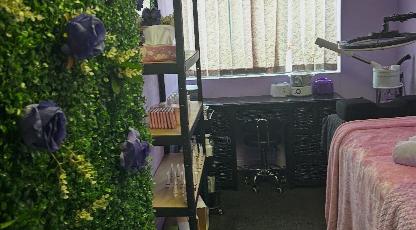 Relaxing treatment room at Face Card Aesthetics, Pretoria, Gauteng, ZA, with lush foliage and plush decor.