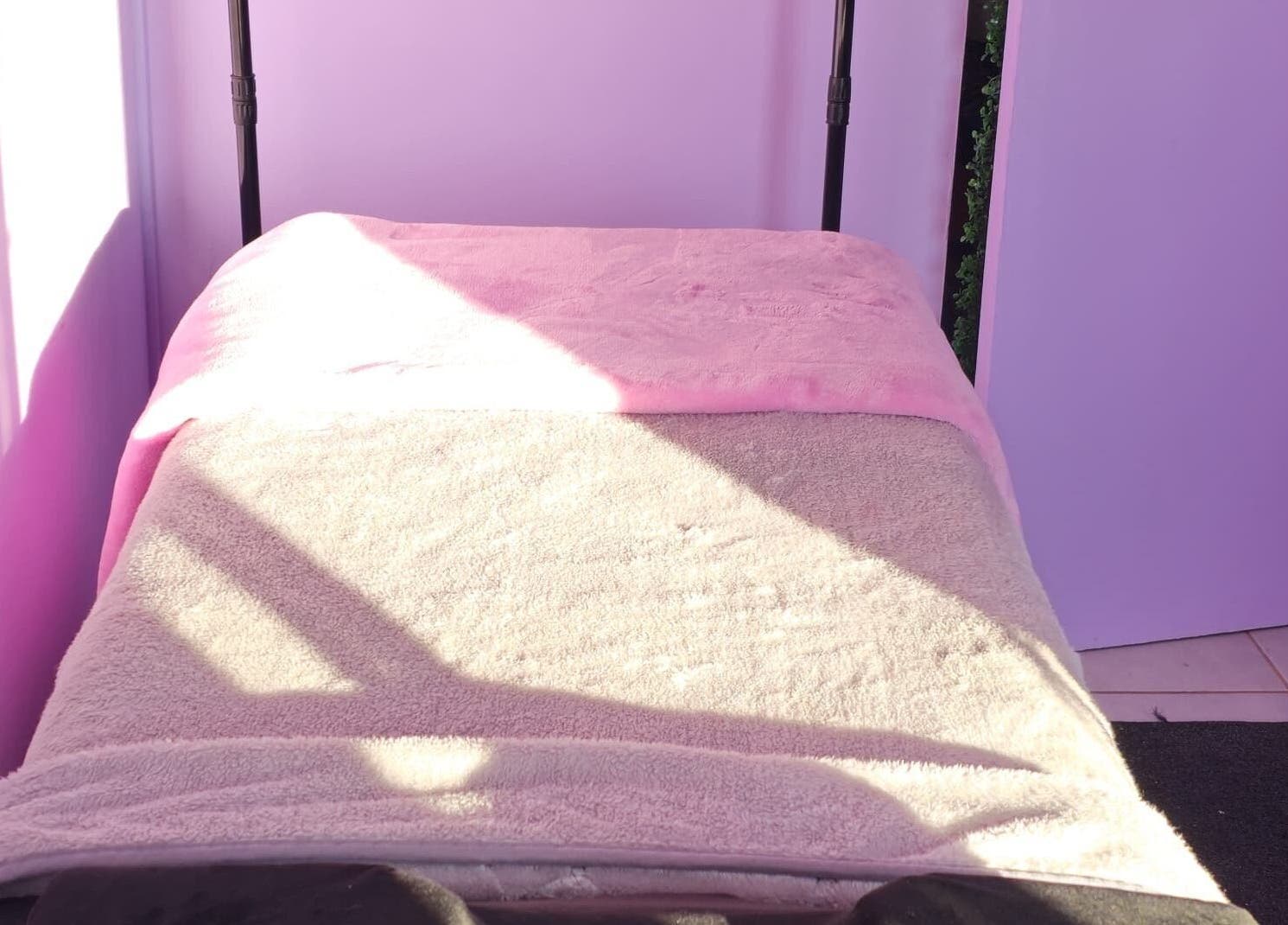 Sunlit treatment bed at Face Card Aesthetics, Pretoria, Gauteng, ZA, offering a relaxing spa ambiance.