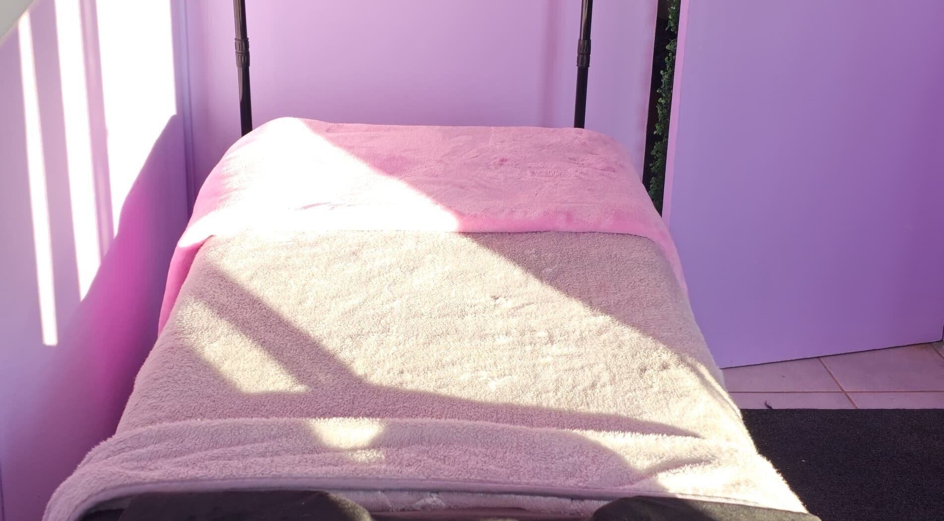 Sunlit treatment bed at Face Card Aesthetics, Pretoria, Gauteng, ZA, offering a relaxing spa ambiance.