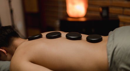 Hot stone massage at Head 2 Toez Spa in Tucson, Arizona, US offering relaxation and wellness therapy.