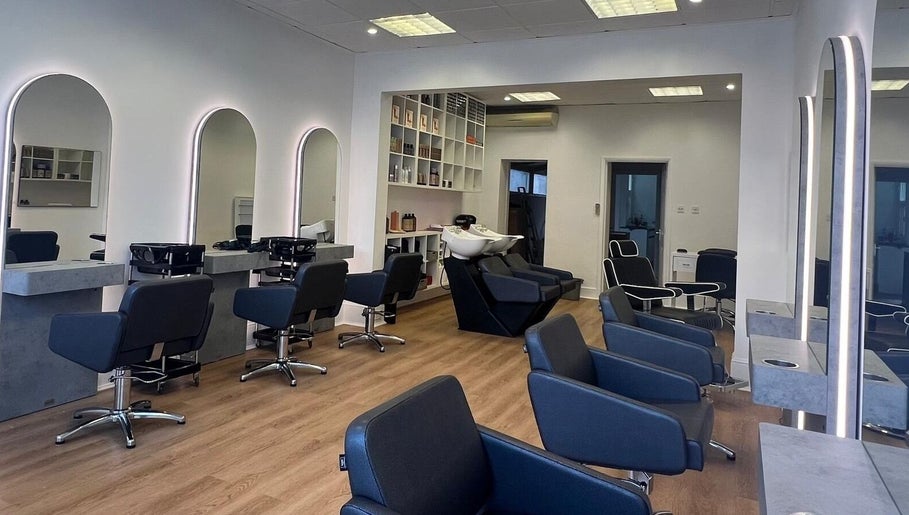 Modern salon interior with sleek chairs and mirrors at estezone, Tonbridge, England, GB.