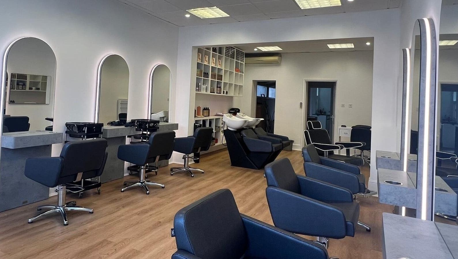 Modern salon interior with sleek chairs and mirrors at estezone, Tonbridge, England, GB.