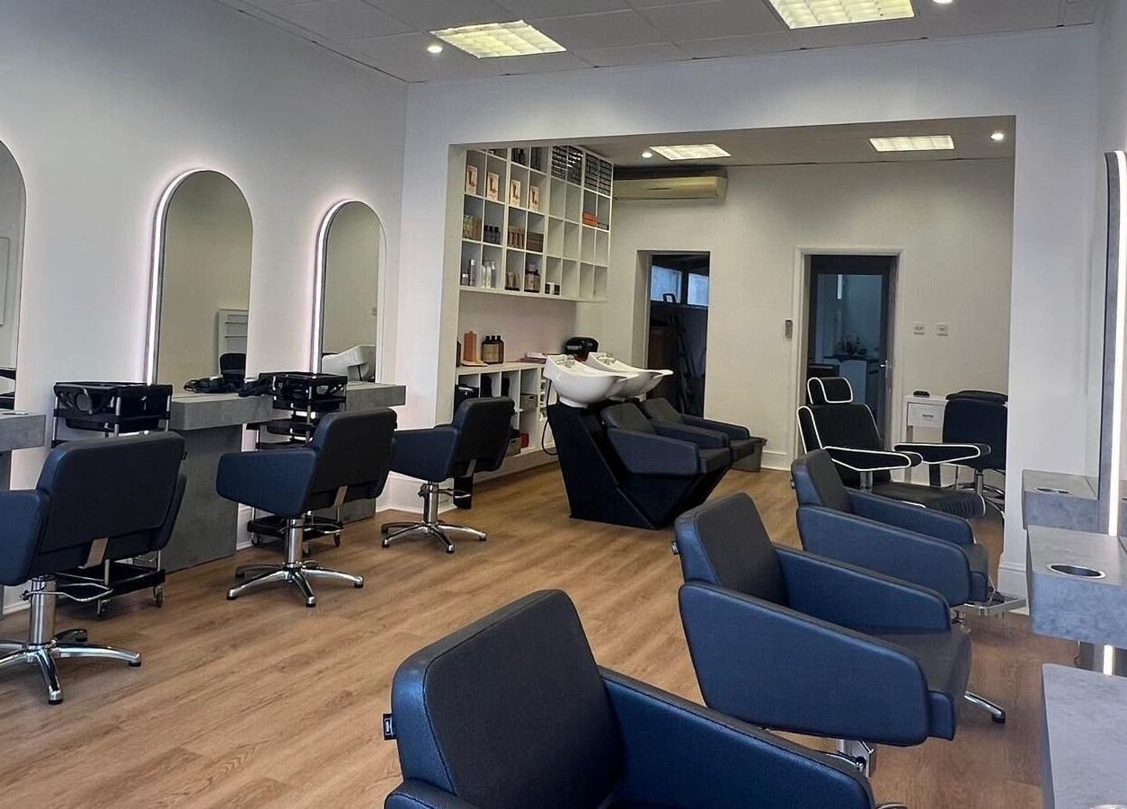 Modern salon interior with sleek chairs and mirrors at estezone, Tonbridge, England, GB.