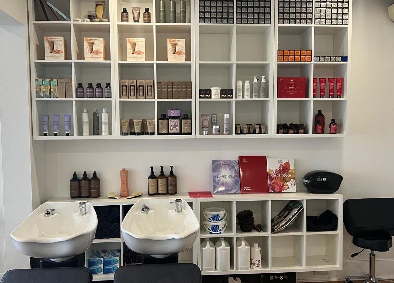 Estezone salon's stylish hair product display and wash stations in Tonbridge, England, GB.