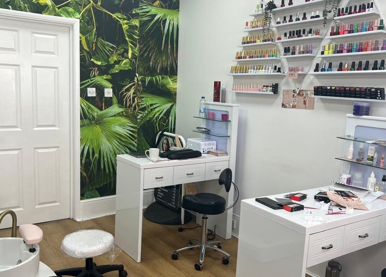 Chic nail salon setup at Estezone, Tonbridge, England, GB with modern decor and vibrant nail polish displays.