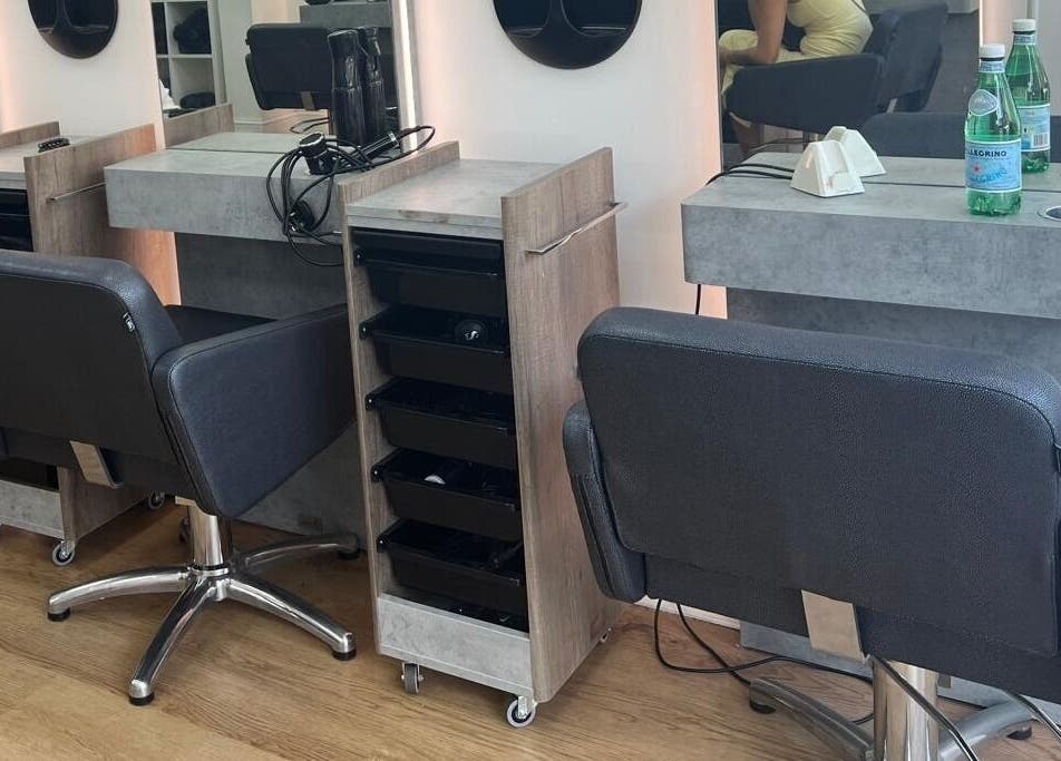 Modern salon chairs and workspace at estezone, Tonbridge, England, GB, offering beauty and relaxation.