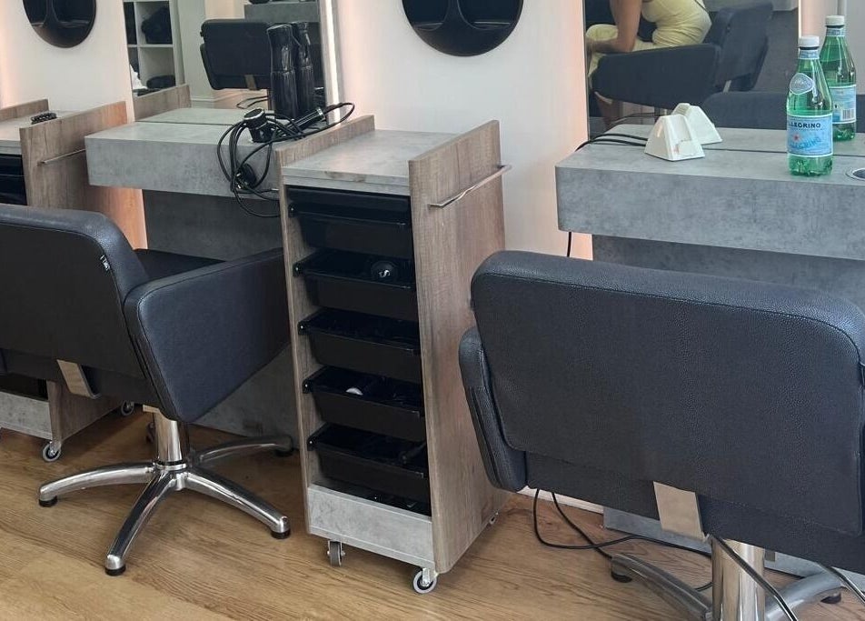 Modern salon chairs and workspace at estezone, Tonbridge, England, GB, offering beauty and relaxation.