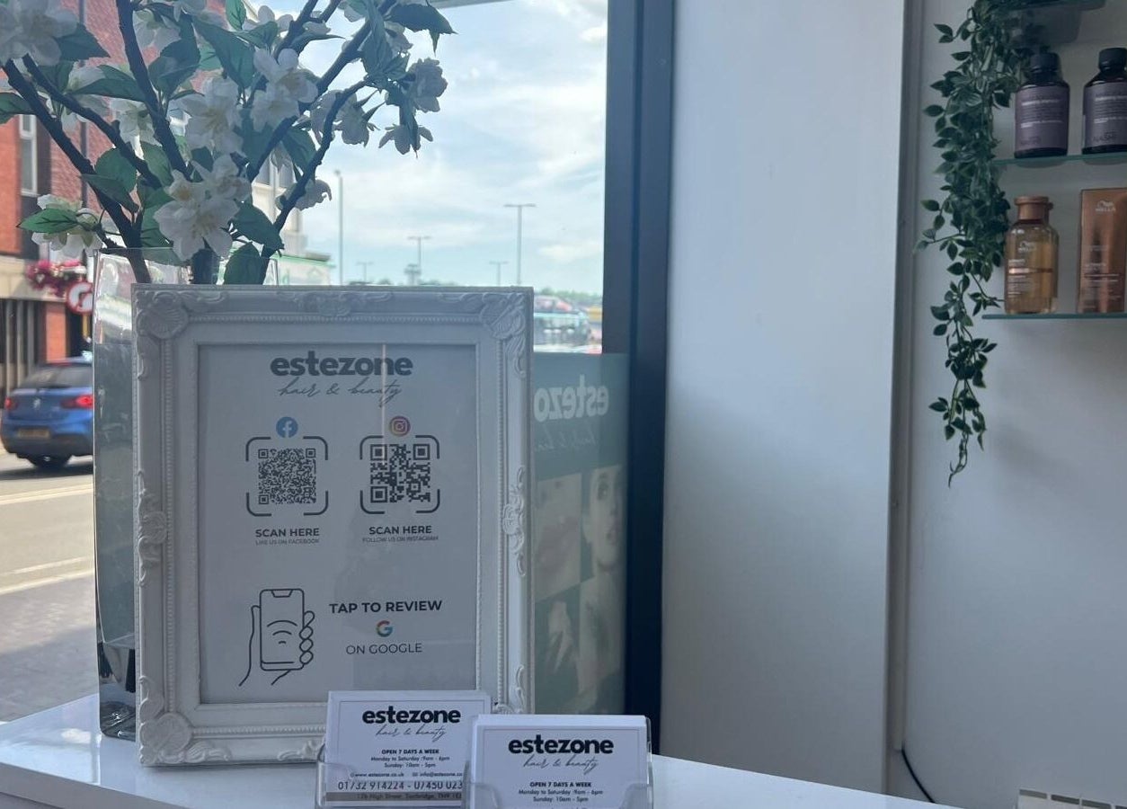 Elegantly framed QR codes and products in Estezone, Tonbridge, England, GB enhance the sleek interior.