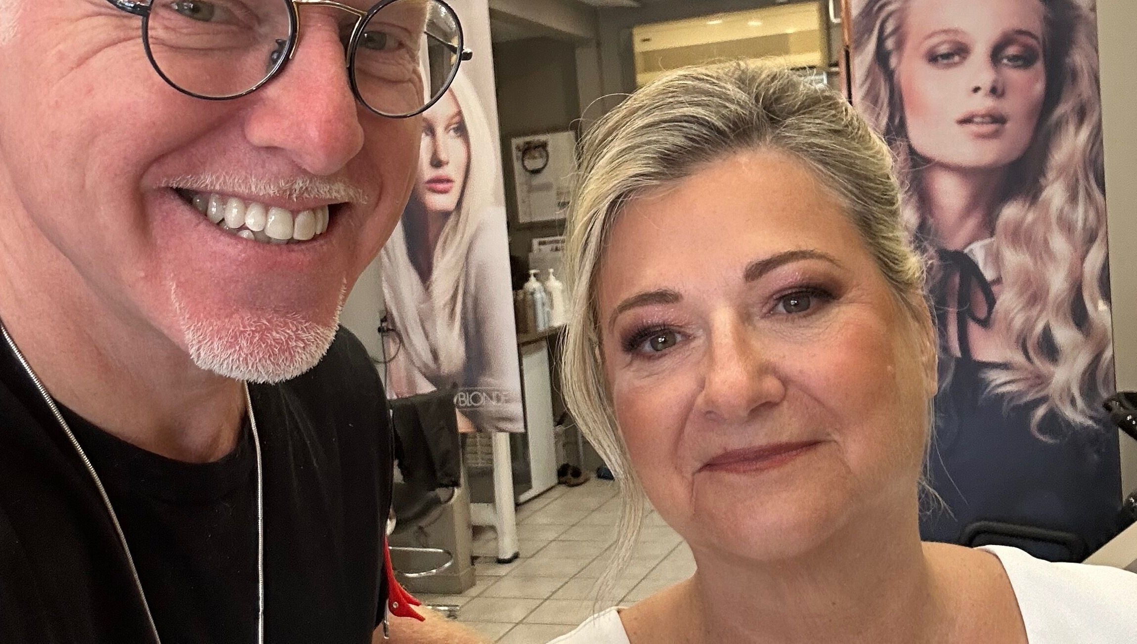 Smiling stylist at Toddchristopher.stylist with satisfied client in Ottawa, Ontario, CA, showcasing beauty services.