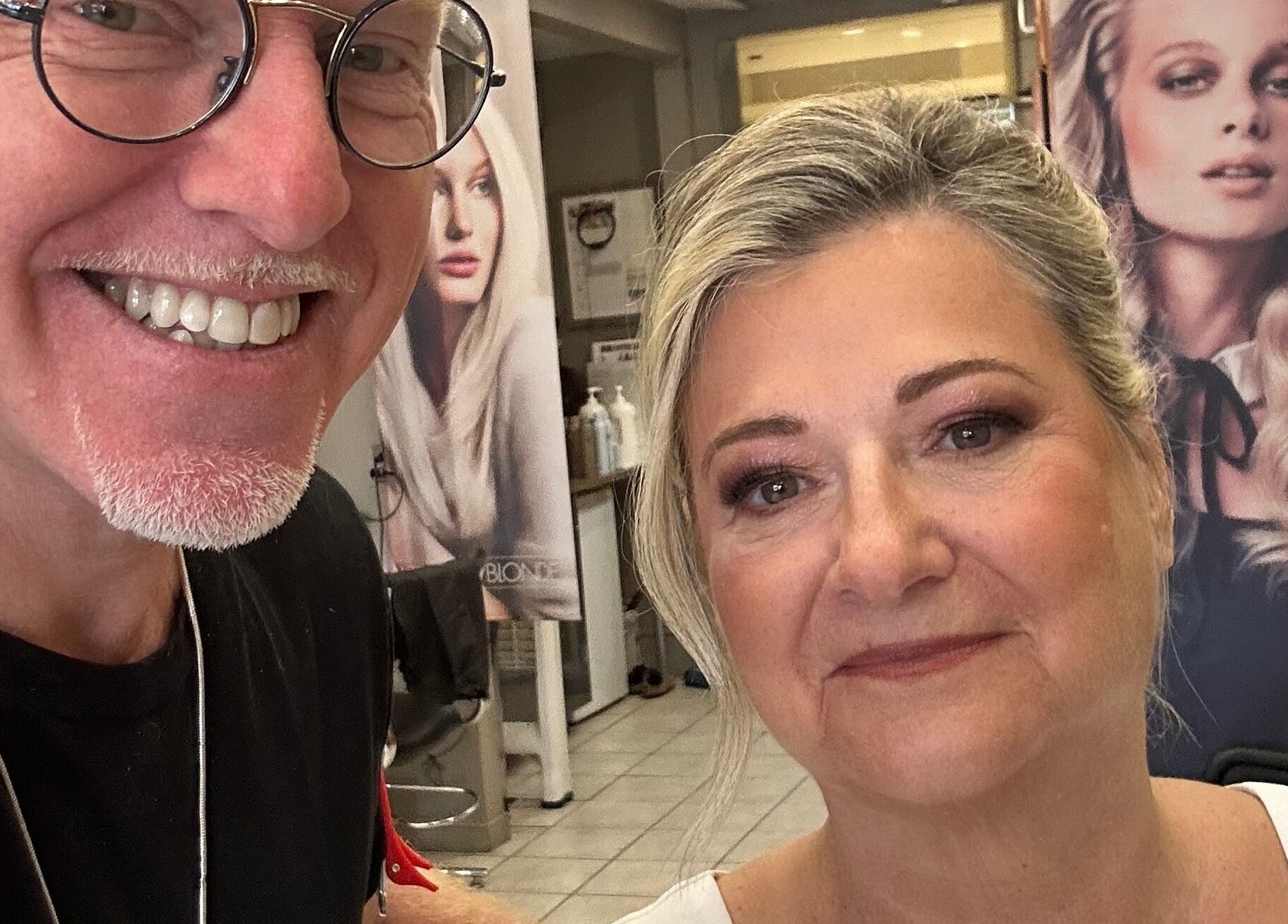 Smiling stylist at Toddchristopher.stylist with satisfied client in Ottawa, Ontario, CA, showcasing beauty services.