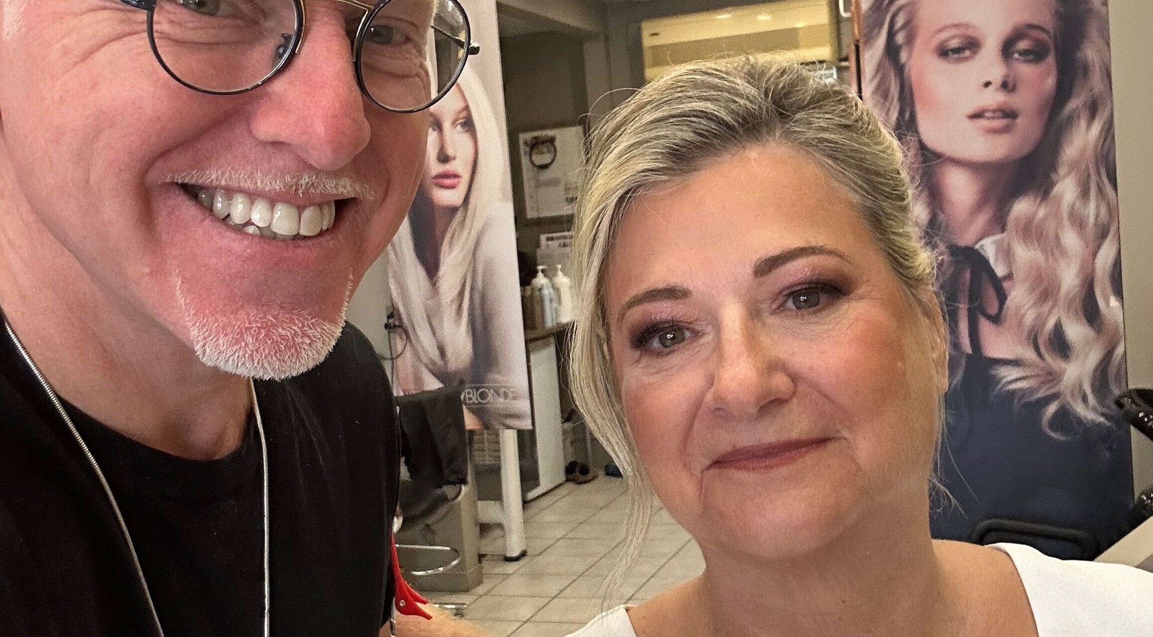 Smiling stylist at Toddchristopher.stylist with satisfied client in Ottawa, Ontario, CA, showcasing beauty services.