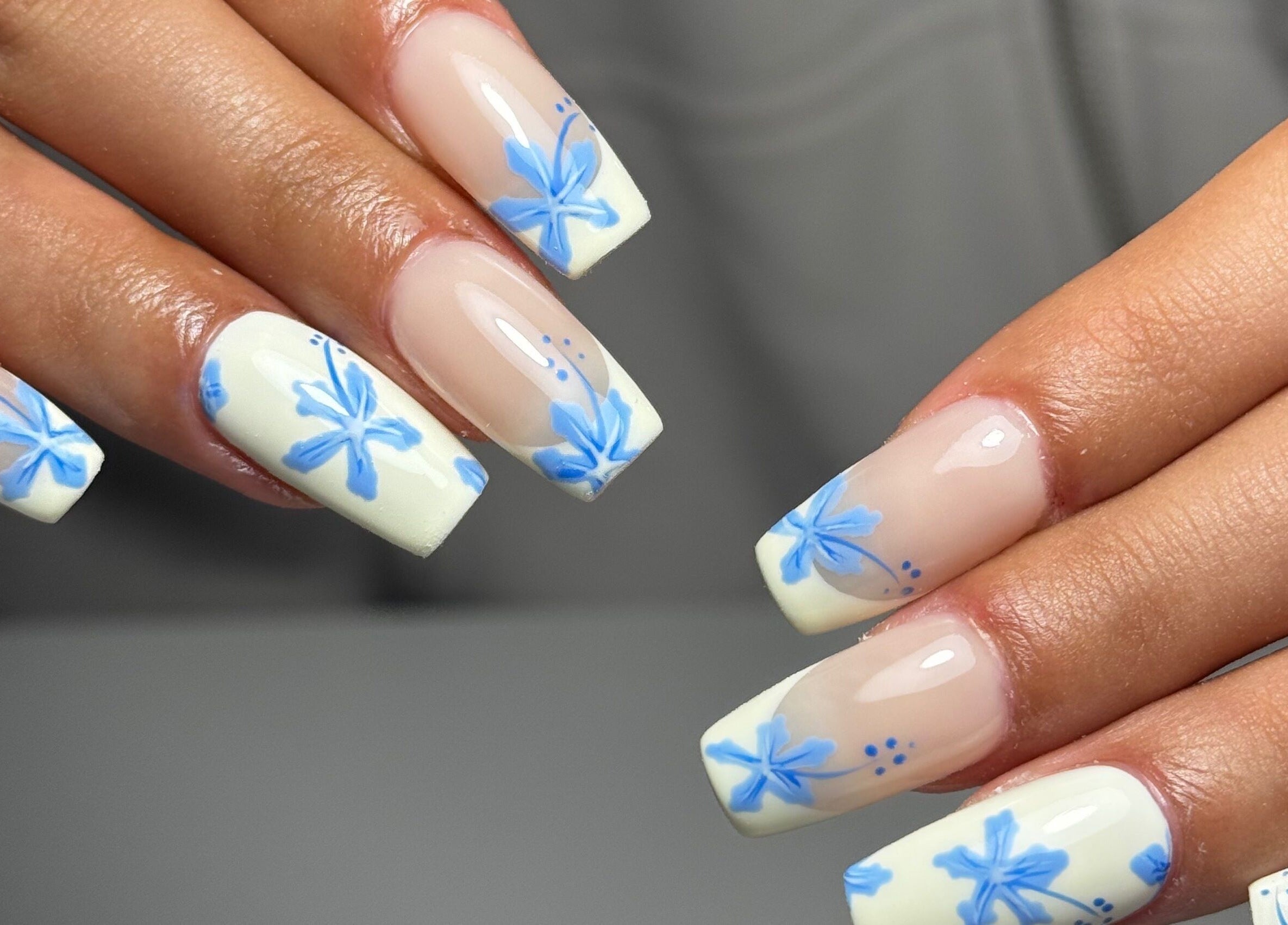 Elegant floral nail art at B's Nail Lounge, Cartwright, New South Wales, AU, showcasing blue designs.