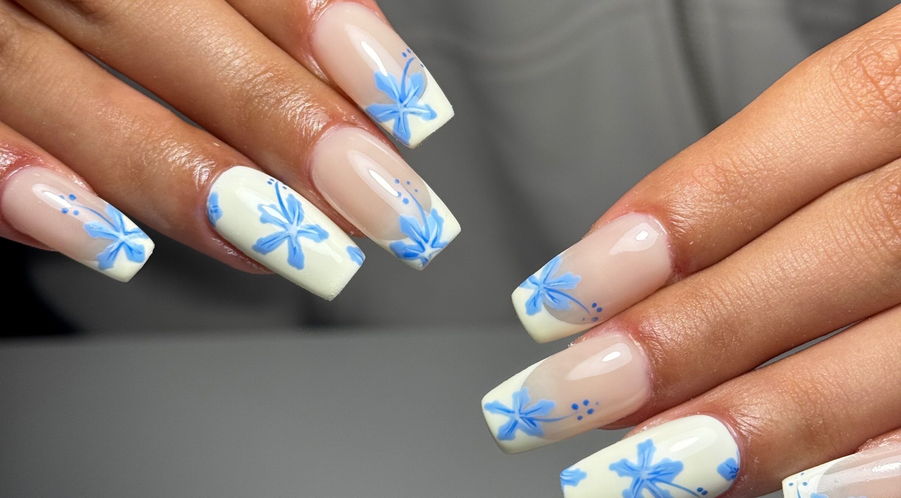 Elegant floral nail art at B's Nail Lounge, Cartwright, New South Wales, AU, showcasing blue designs.