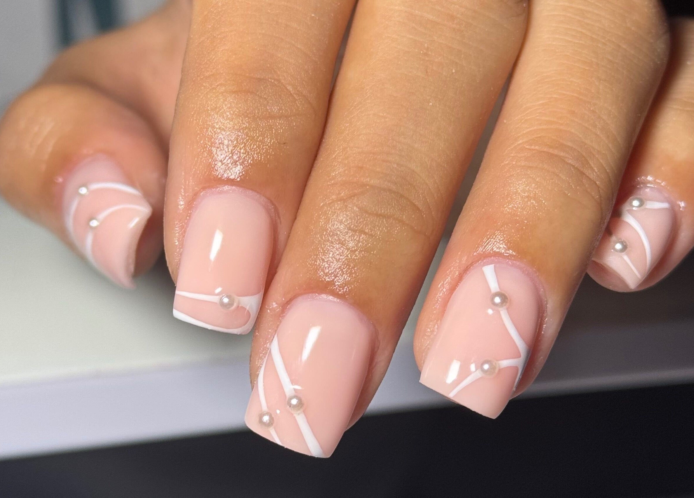 Stylish pearl-accented nails at B's Nail Lounge, Cartwirght, New South Wales, AU.