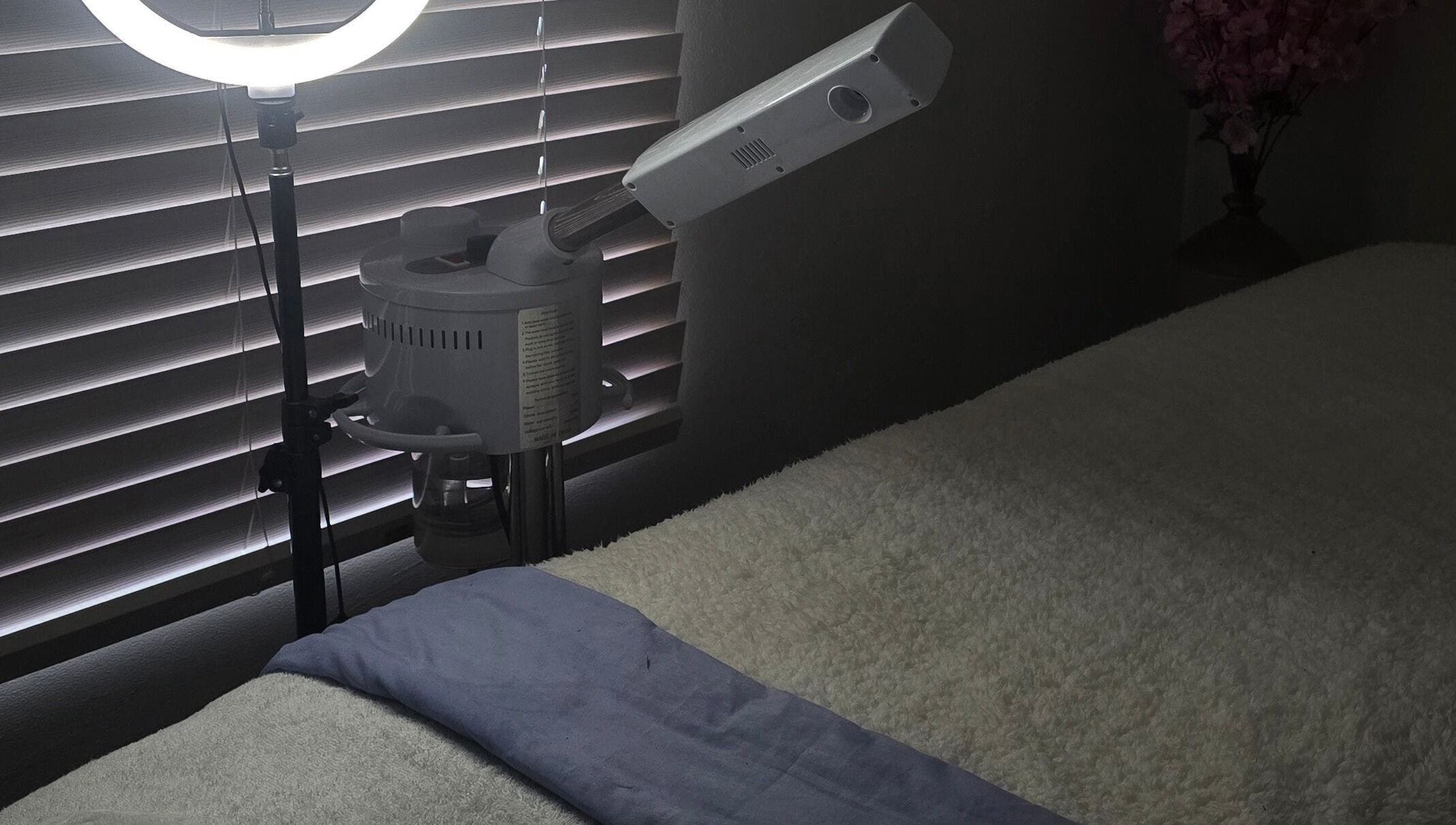 Cozy treatment room at Whispering Waters, Bloemfontein, Free State, ZA with massage bed and professional lighting.