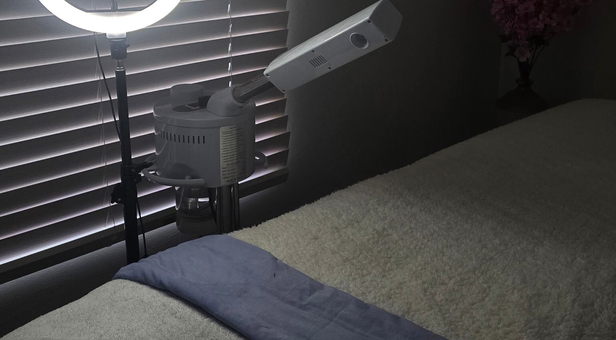 Cozy treatment room at Whispering Waters, Bloemfontein, Free State, ZA with massage bed and professional lighting.