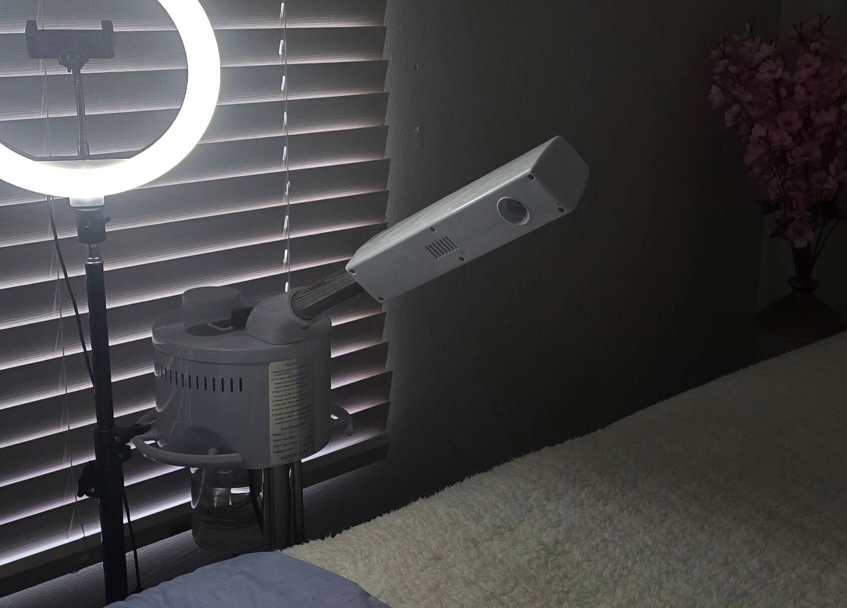 Relaxing spa room at Whispering Waters, Bloemfontein, Free State, ZA, featuring a ring light and massage bed.