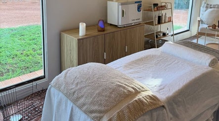 Relaxing treatment room setup at Tiarne Lauren Beauty, Vasse, Western Australia, AU, featuring a massage bed.