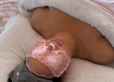 Relaxing facial treatment at Tiarne Lauren Beauty, Vasse, Western Australia, AU with soothing eye mask applied.