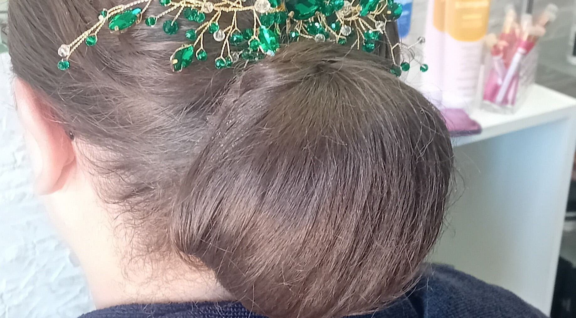 Elegant updo with green gemstone hairpin at Chaell hairsalon, Tarxien, MT.