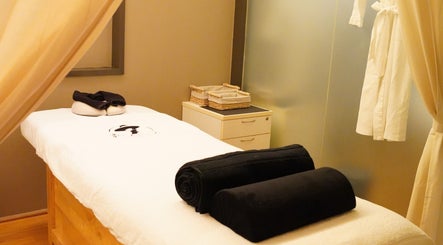 Relaxing treatment room at The Ladies Society SPA, Ampang, Selangor, MY, featuring a comfortable massage bed.