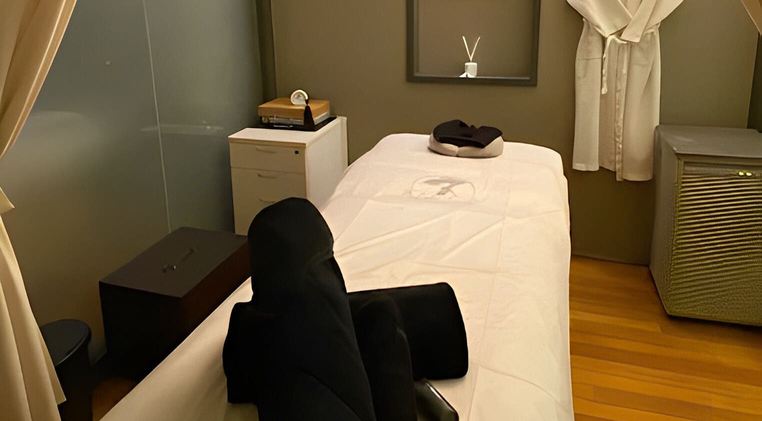 Relaxing massage room at The Ladies Society SPA, Ampang, Selangor, MY, featuring a cozy massage table and soothing ambiance.