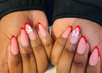 Red-tipped nail art with white accents from Priscillas Beauty Spot, Pretoria, Gauteng, ZA.
