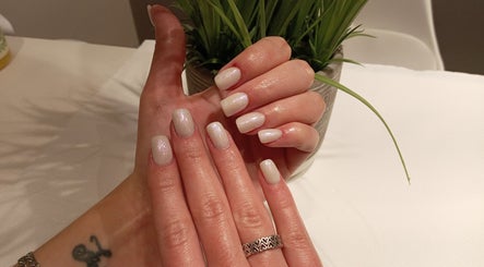 Manicured hands with glossy nails at Priscillas Beauty Spot, Pretoria, Gauteng, ZA.