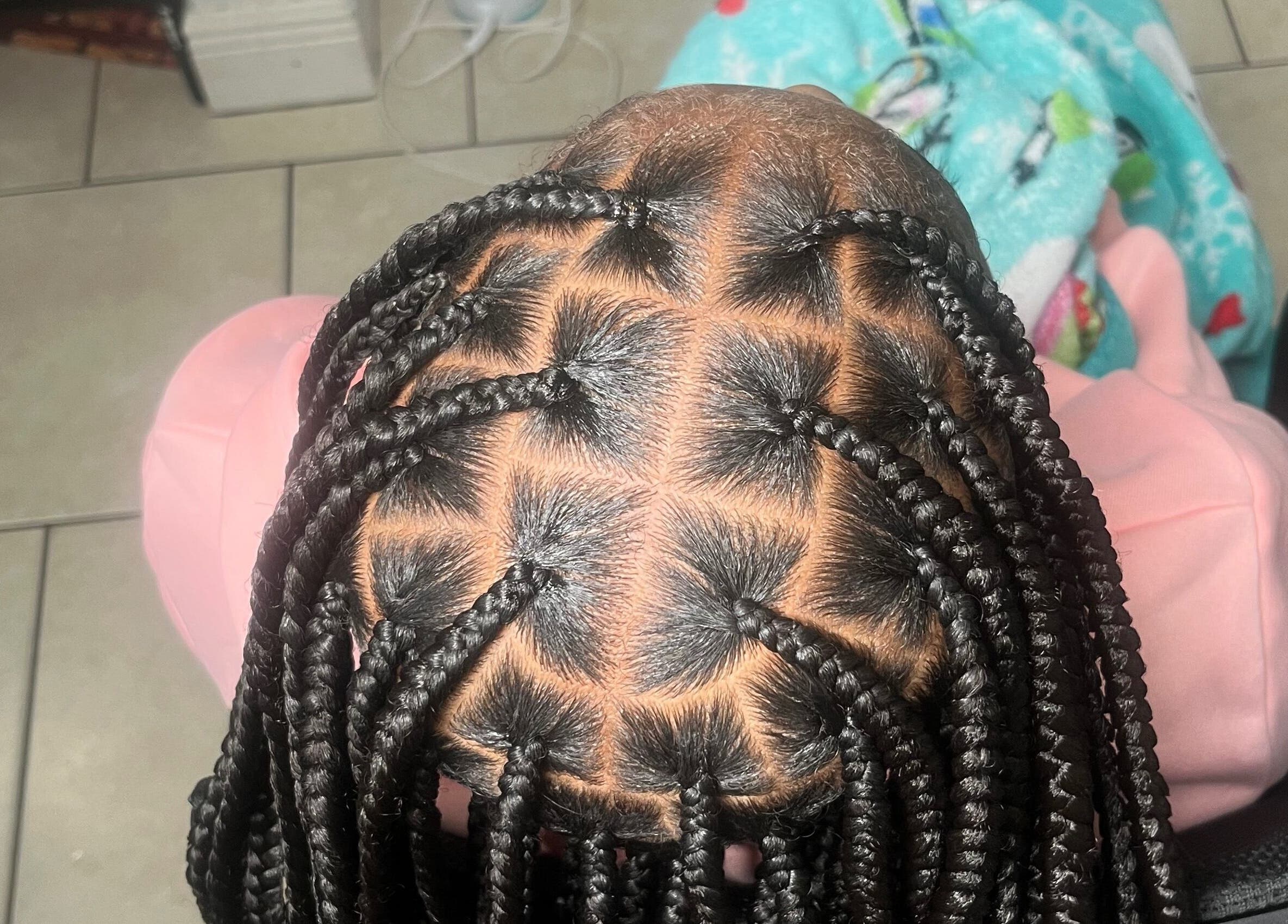 Intricate braids at Berry’s Roots in Opa-locka, Florida, US offer a unique beauty style.